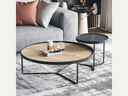 Round coffee table with black legs and wood top