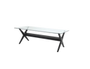 A dining table with black base and a  glass top from Eichholtz.